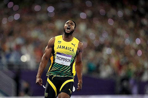 Kishane Thompson reacts after crossing the finish line during men's 100 meters final